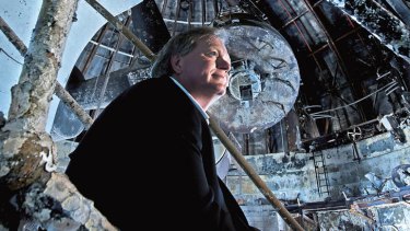 About Schmidt … astrophysicist Brian Schmidt at the burnt-out telescope at the Mount Stromlo Observatory.