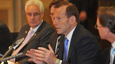 Prime Minister Tony Abbott at a roundtable discussion on the carbon tax with business leaders on Friday.