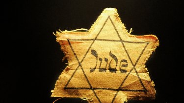 A cloth star with the word 'Jude', German for Jew, that Jews had to wear during the Nazi occupation.