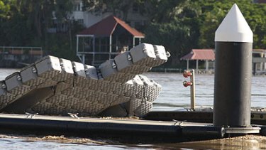 A pontoon wedged into a jetty in New Farm this morning. Photo: Reuters/Mick Tsikas