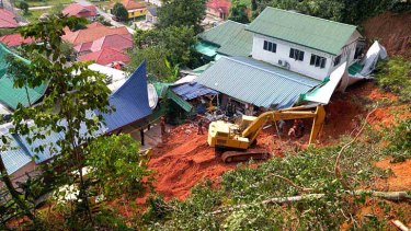 An orphanage sits crushed by a landslide in Hulu Langat, outside Kuala Lumpur.
