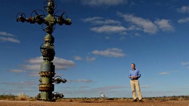 Petratherm Exploration manager Peter Reid at a geothermal wellhead in South Australia.
