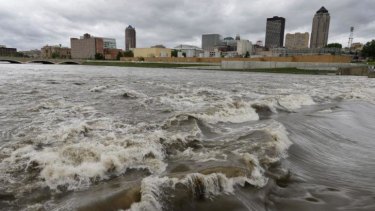 Extreme conditions ... Water splashes over the Centre Street Dam in the swollen Des Moines River in downtown Des Moines, Iowa on May 30, 2013. 