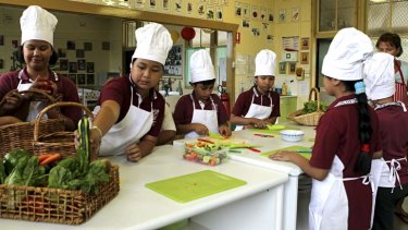 A cut above: Students at Old Guildford Public School, which secured more than $100,000 in grants over two years to build a kitchen garden and alfresco dining area.