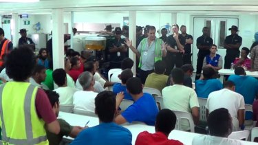 A still from video footage of a meeting on Manus Island that descended into combative chaos between asylum seekers and security officials.