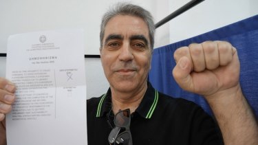 Billis Vaghelis, 59, votes 'Oxi' ('No') in the Athens suburb of Cholargos during the Greece EU bailout referendum.