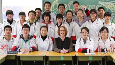 Prime Minister Julia Gillard with year 11 students at Chenjinglun High School in Beijing.