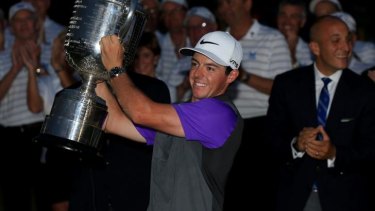 Rory McIlroy lifts the Wanamaker trophy for the second time.