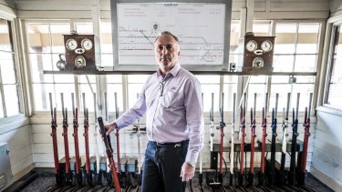Kilmore East station master Colin Mans with the double line block signalling system. 