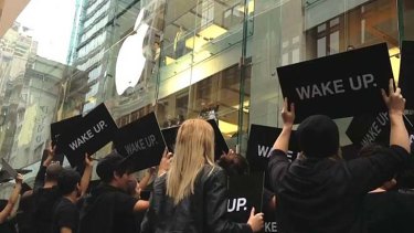 'Wake Up' protestors outside Apple's Sydney CBD store.