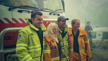 PM Tony Abbott with members of the Davidson fire brigade after helping with a backburining operation near Bilpin, NSW.