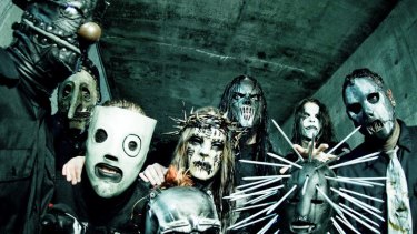 Slipknot's Shawn Crahan (far left, with doorknob nose) says the band pride themselves on giving their all when performing.