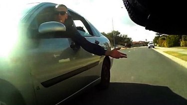 The passenger was caught on camera, slapping the cyclist on the bum.