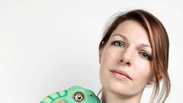Kate Darling, research specialist at MIT Media Lab, with Peter, her pet Pleo baby dinosaur. Yoshi, another Pleo pet, broke or "died". 