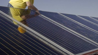 A potential boom in commercial take-up of solar energy would be costly, an agency finds.