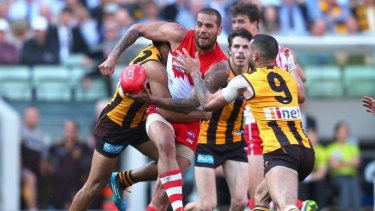 Not today, Buddy: Lance Franklin is closed down by the Hawks defence.
