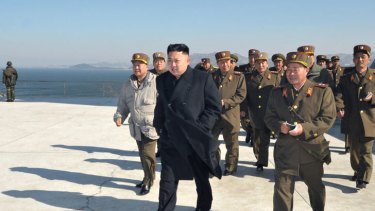 North Korean leader Kim Jong Un inspects a live ammunition firing drill by the Jangjae Islet.