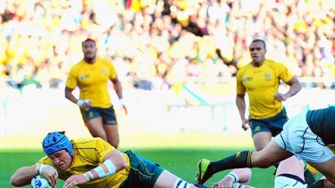 James Horwill of Australia goes over for the only try of the game.