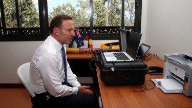 Prime Minister Tony Abbott speaks with ASIO Director-General Duncan Lewis via a secure tele-conference from Arnhem Land. 