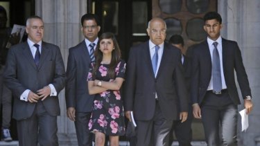 Labour MP Keith Vaz, centre, with Jacintha Saldanha's family:  husband Benedict Barboza, second left, her daughter Lisha, third left, and son Junal, right, following an inquest into her death.
