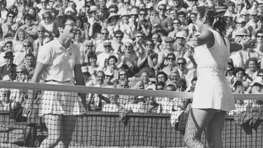 Judy Dalton, with her arms open wide, acknowledges her defeat by Billie Jean King in the Wimbledon women's singles quarter-finals in 1969.