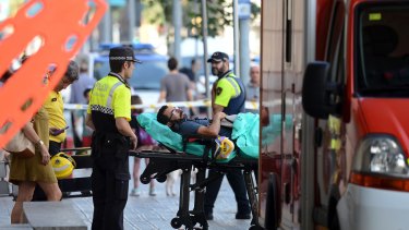 An injured passenger is taken to hospital after a train crash at Barcelona’s França station.