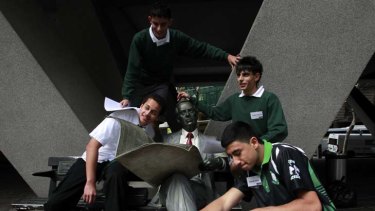 Fostering the future ... Mahdi Saleh, front, with his Airds high school classmates. The group are taking part in a treasure hunt in the city designed by mentors at Aussie Home Loans.