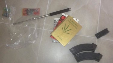 Drug paraphenalia, weapons, and ammunition police say they seized during Townsville raid on Rebels bikies