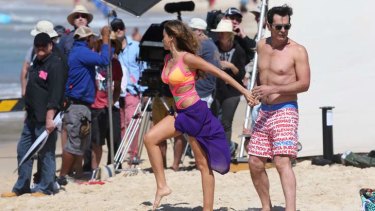 Sofia Vergara on the <i>Modern Family</i> set with co star Ty Burrell at Bondi Beach.