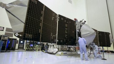 Technicians work on the MAVEN Mars orbiter last year.