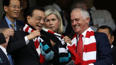Chinese Premier Li Keqiang and Prime Minister Malcolm Turnbull share a joke at the Sydney Cricket Ground. 
