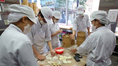 Chefs prepare their world-famous dumplings at Din Tai Fung.