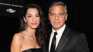 'This is not just an attack on Sony' ... George Clooney, pictured here with wife Amal Alamuddin, is furious that no Hollywood celebrity would sign a petition he circulated against the cyber hackers that resulted in Sony shelving The Interview.