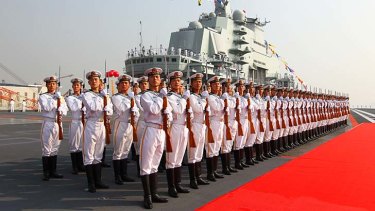 Naval power ... military officers onboard China's aircraft carrier, Liaoning.