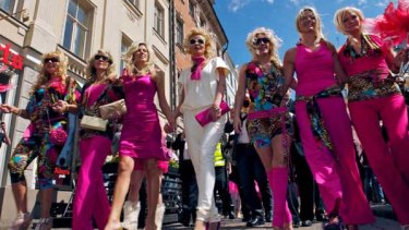 Blondes parade through the streets of Latvia's capital Riga.