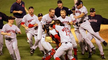 Boston Red Sox celebrate after defeating the St. Louis Cardinals in the 2004 World Series.