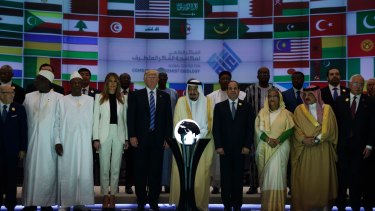 President Donald Trump and Saudi King Salman pose for photos near the orb.