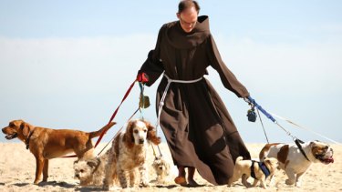 Friar Matthew Hufer  oversaw a blessing ceremony for pets at Port Melbourne beach yesterday as part of celebrations for the Feast of St Francis of Assisi.
