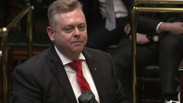 Anthony Roberts with the lump of coal in Parliament. 