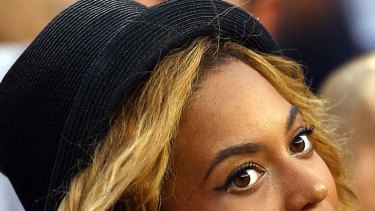 Nothing secret about it... Beyonce Knowles flashes her large engagement ring.