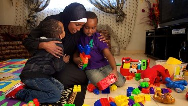 Empowering &#8230; Deeqo Omar with Aqil Barruud, 4, left, and Hamza Abdullahi, 6, at a home childcare centre in Granville.