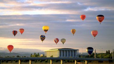 Canberra's masterpieces ... ballooning at dawn over the city.