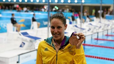 Bronze ... Australia's Alicia Coutts shows off her medal after coming third in the 100m butterfly.