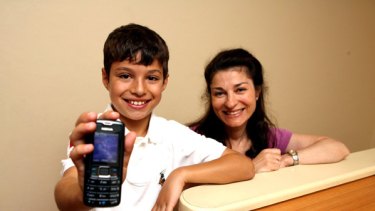 Luke Gaffney of Double Bay with his mobile phone, left, and his mother Irene.