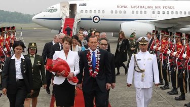 Ruffled feathers, at least among the media: Prime Minister Tony Abbott and his wife Margie on arrival in Jakarta last Monday.