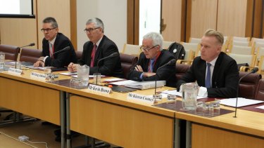 Greg Adcock, second from left, received a $1.5 million termination bonus when he left NBN Co.