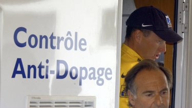 Drug charges ... Lance Armstrong exits an anti-doping control bus during the Tour de France