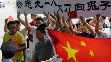 Some protesters, though, march unmolested. These Chinese activists, egged on by Beijing authorities, express their anger about Japan's 1930s occupation of Manchuria.