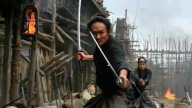 Talk to the sword: Two samurai warriors get ready to get down in Takashi Miike's fabulous action flick <i>13 Assassins</i>.