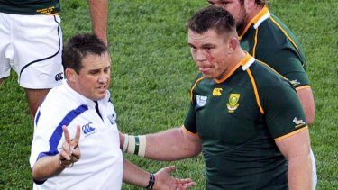 Referee Bryce Lawrence talks to Springboks captain John Smit during World Cup quarter-final loss to Australia.